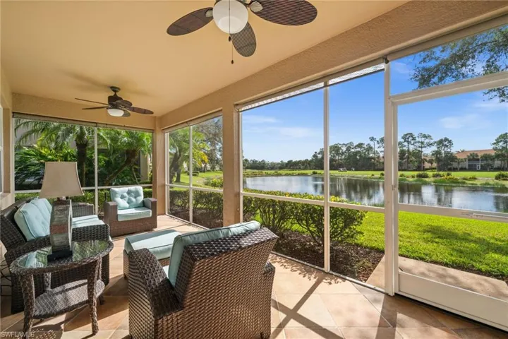 Sunroom featuring a water view, a ceiling fan, and an outdoor hangout area