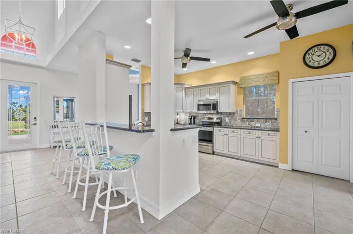 Front entry and open floor plan with breakfast bar.