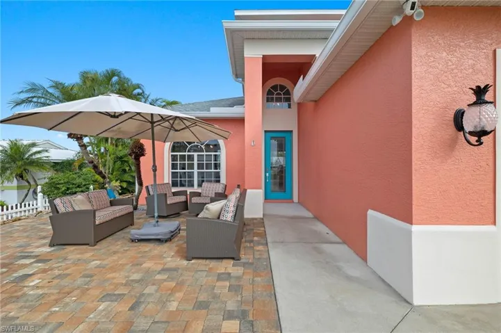 Entry with pavered sitting area.
