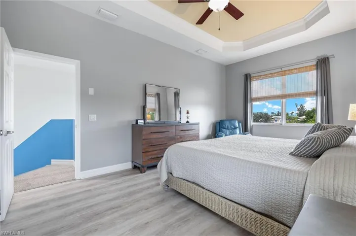 Master Bedroom with tray ceiling and lots of natural light.