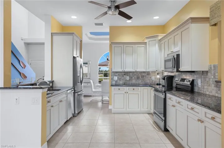 Granite counters and stainless appliances in this beautiful kitchen.