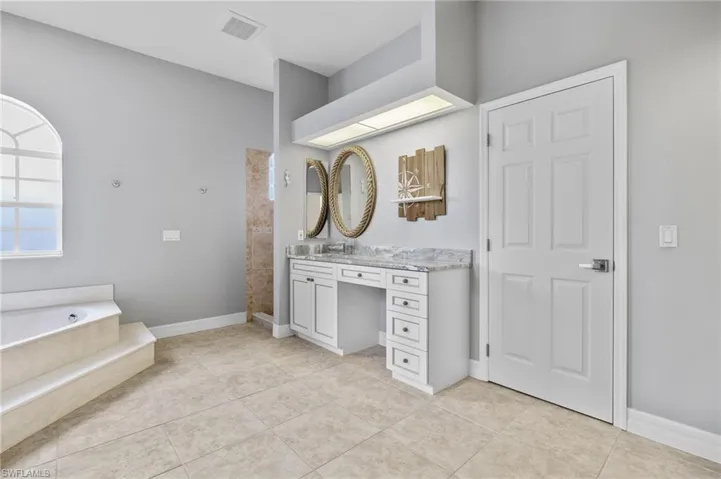 Master Bath with jacuzzi tub and large walk-in shower.