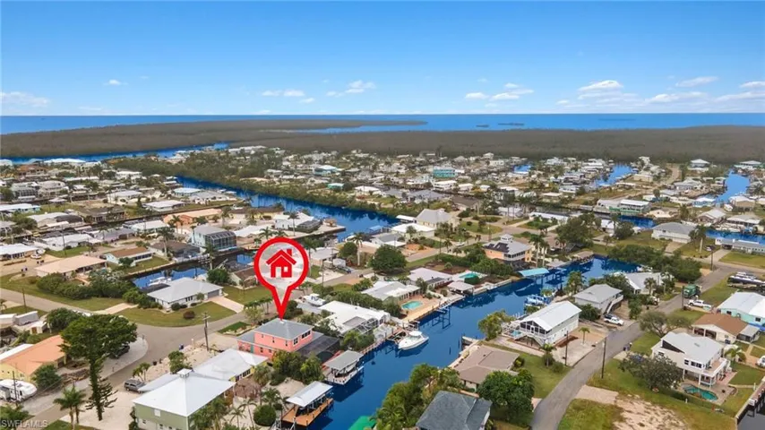 Aerial looking SW of home with San Carlos Bay, Pine Island Sound, and the ICW.