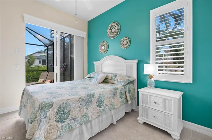 Guest bedroom #1 with sliders to the pool/lanai.