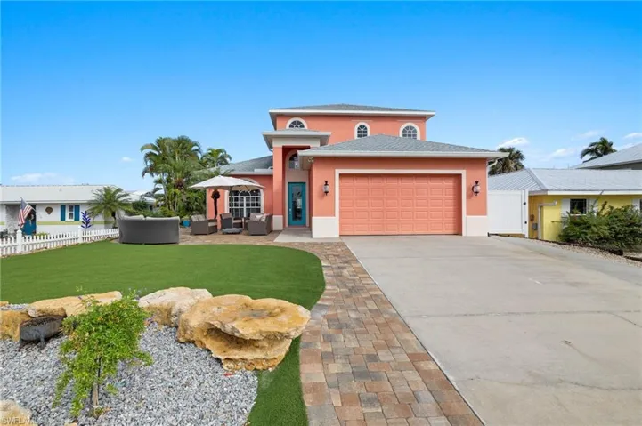 Street view of home with additional parking for RV, boat/trailer, etc.  No HOA restrictions.