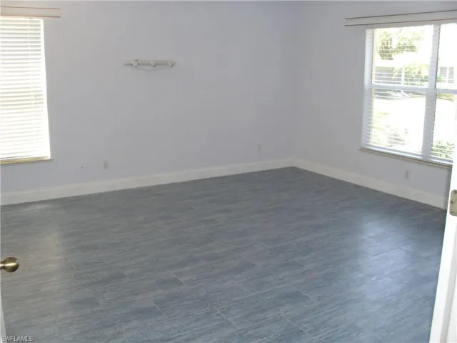 Unfurnished room featuring baseboards
