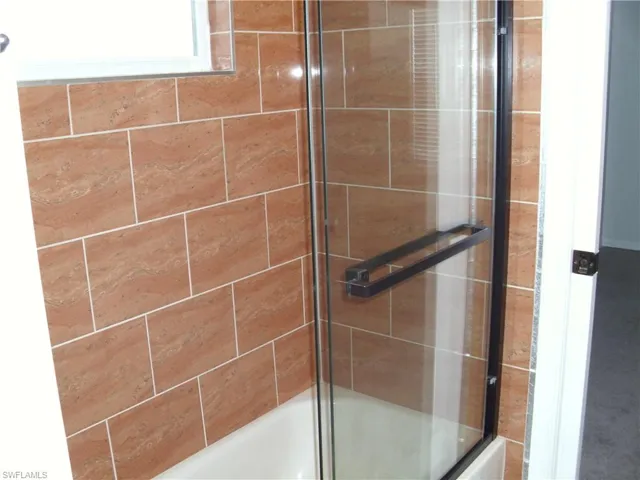 Full bath with enclosed tub / shower combo