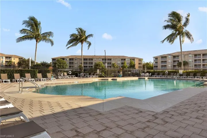 Community pool with a patio