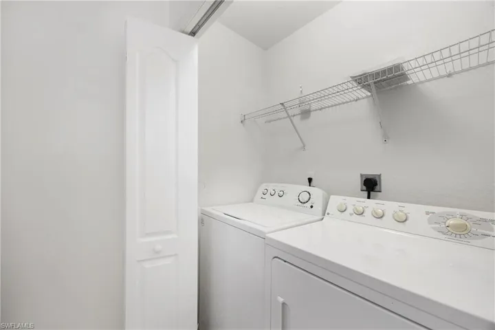 Laundry room featuring washing machine and dryer