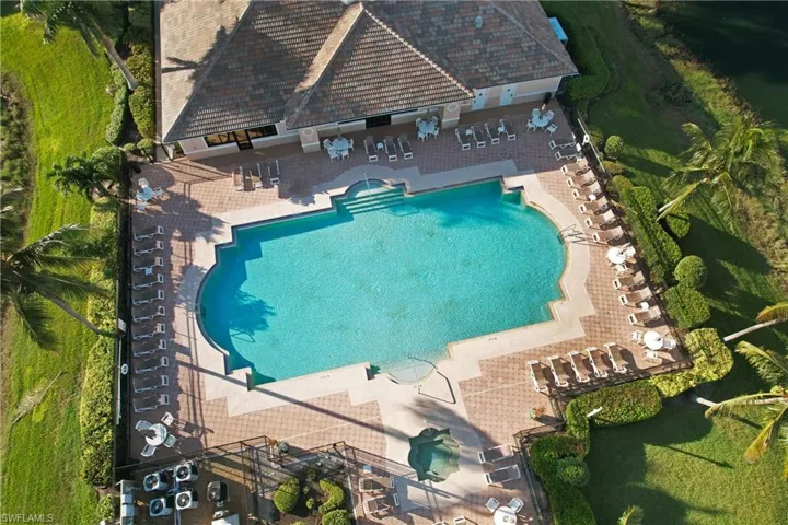 Aerial view of property and surrounding area with a pool