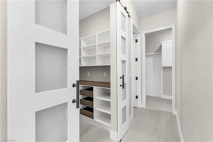 Butler's pantry with glass barn doors
