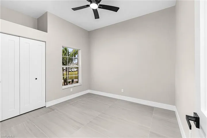 Bedroom featuring a closet and a ceiling fan