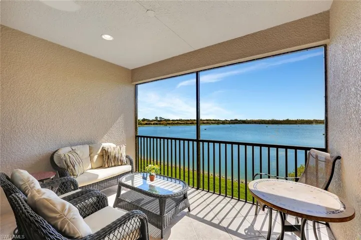 Sunroom with a water view