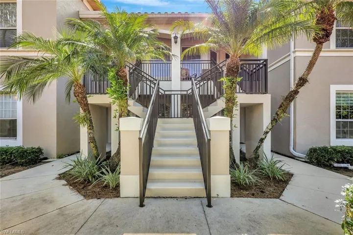 View of property featuring stairway
