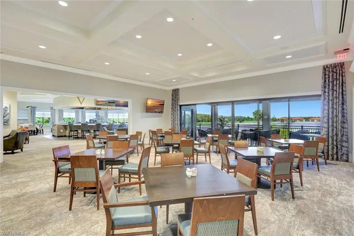 Dining space featuring light carpet, beam ceiling, coffered ceiling, recessed lighting, and crown molding