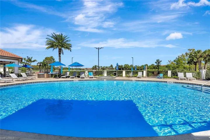 Community pool with a patio area
