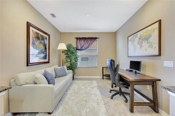 Office featuring baseboards and light tile patterned flooring