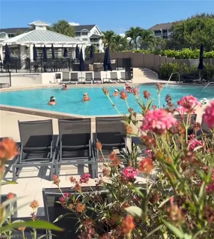 Tarpon Cove Yacht and Racquet Club optional tranferable membership includes resort style pool, tiki bar, bocce, tennis, and fitness.