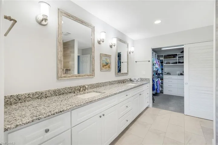 Long, Long Granite Counters, Dual Sinks, Storage Pull Outs, Bahama Doors to Closet Room