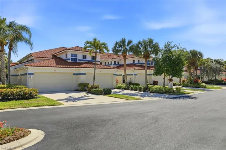 Mediterranean / spanish house with concrete driveway, stucco siding, and a tile roof