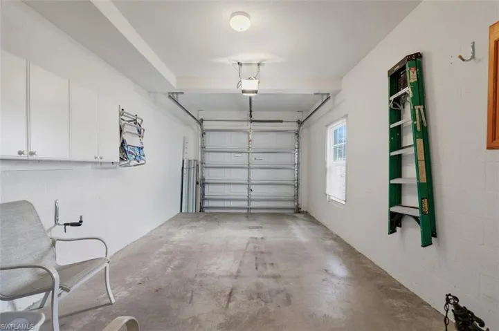 Garage featuring a garage door opener