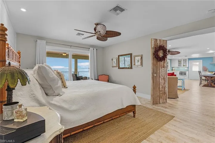 Bedroom featuring ceiling fan and light hardwood / wood-style floors
