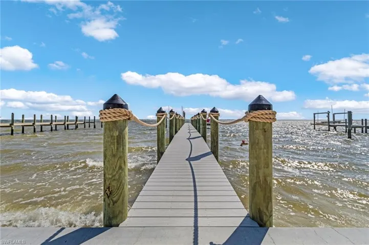 Dock area featuring a water view