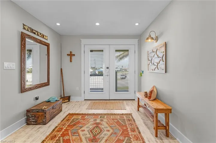 Doorway featuring light hardwood / wood-style floors and french doors