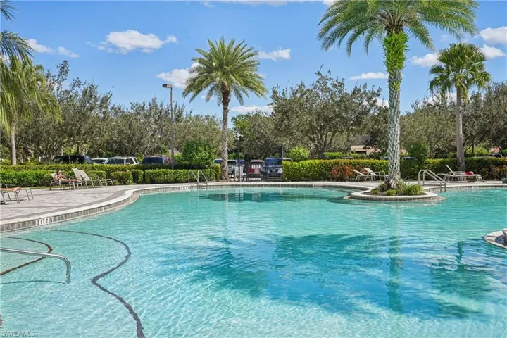 Community pool featuring a patio