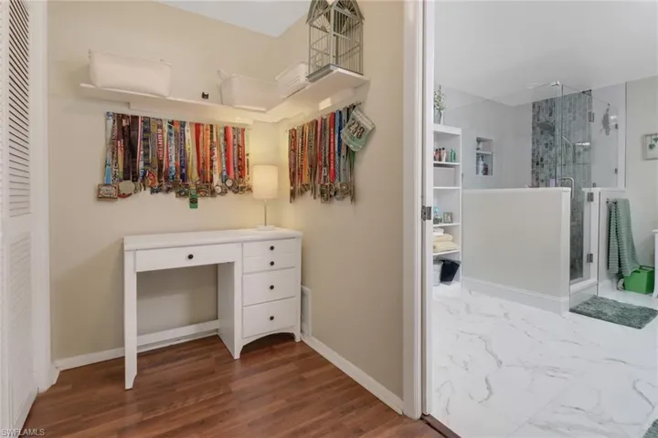 Spacious closet with wood finished floors