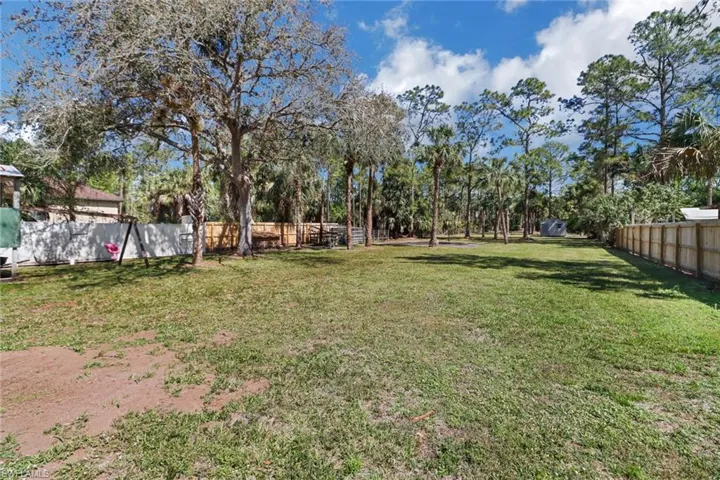 View of yard featuring fence