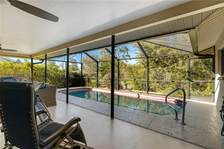 View of swimming pool with ceiling fan