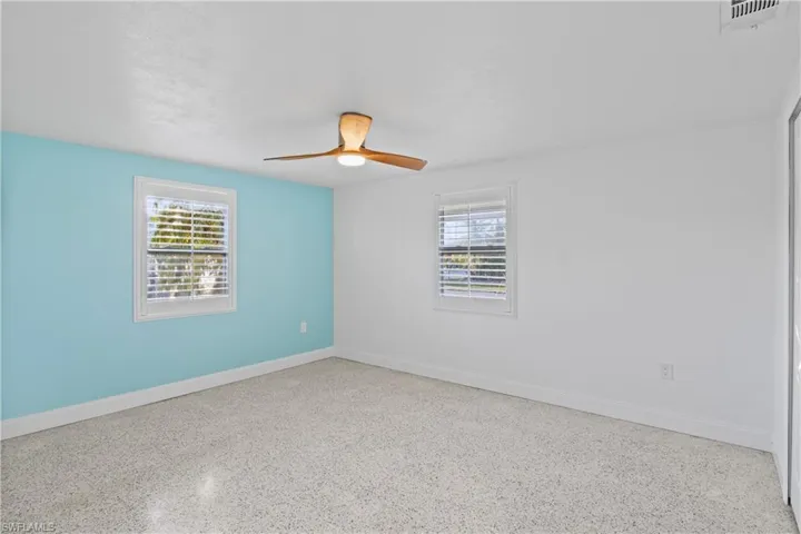 Bright guest bedroom ideal for family, visitors, or a home office setup.