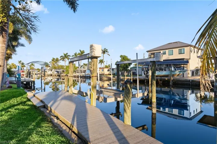 Private dock with boat lift offering quick, direct access to Matlacha Pass and minutes to the Gulf.
