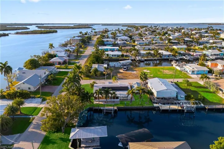 Stunning aerial view showcasing the waterfront location and surrounding island community.