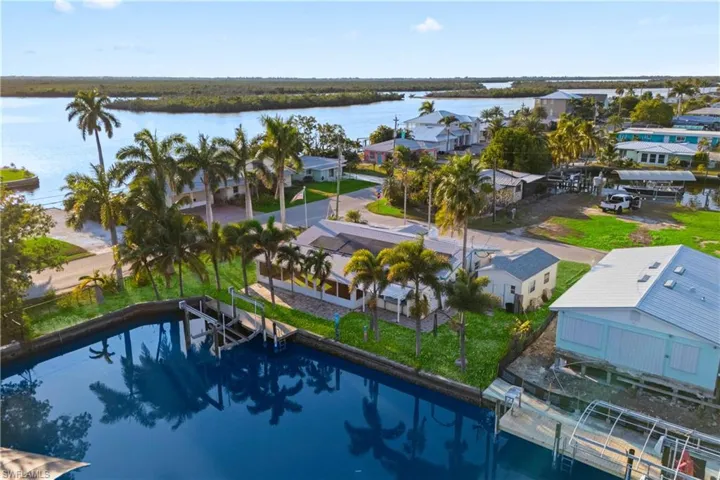 Panoramic aerial perspective highlighting private dock, Matlacha Pass, and Gulf access.