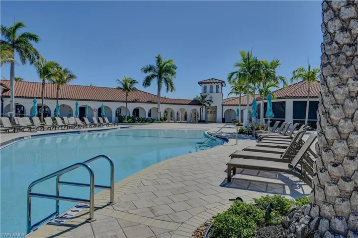 Community pool with a patio