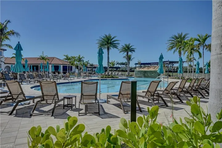 Community pool with a patio