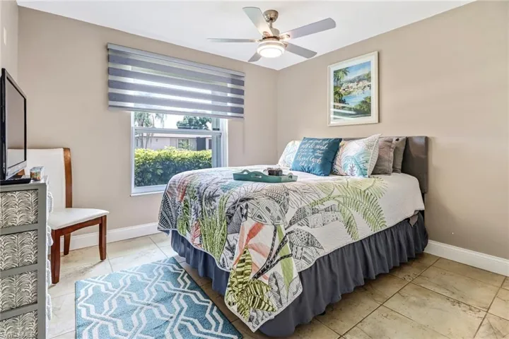 Bedroom with tile floors and ceiling fan