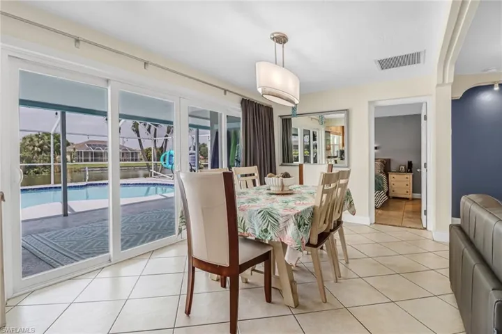 Dining space featuring light tile flooring