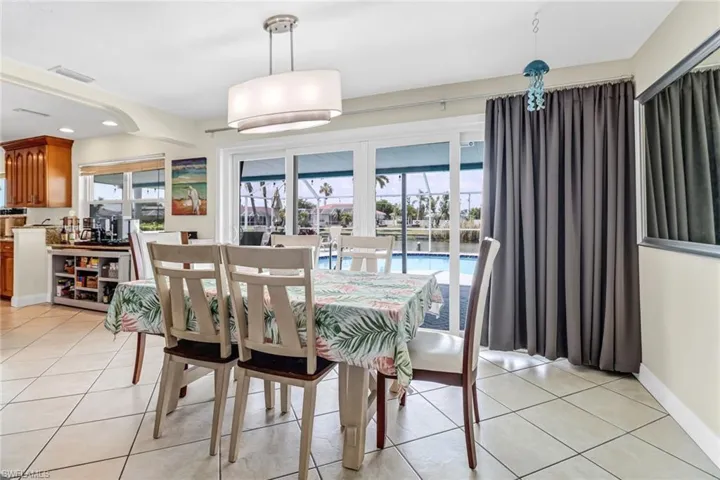 Dining area featuring light tile flooring