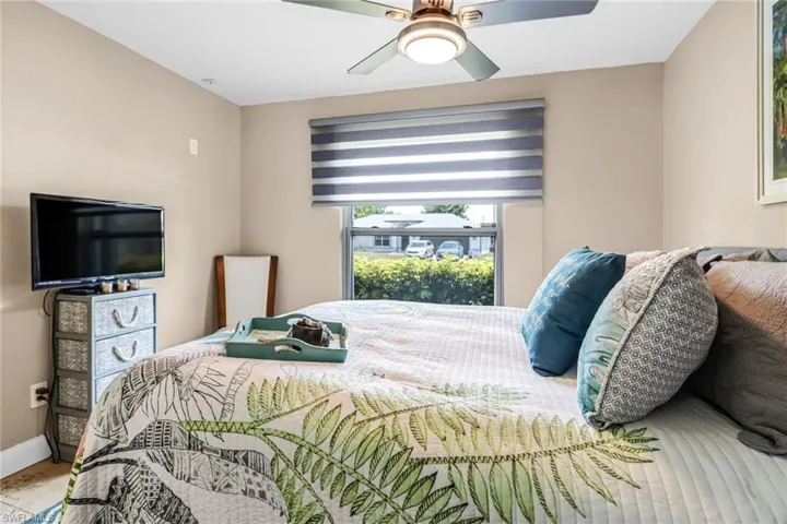 Tiled bedroom with ceiling fan