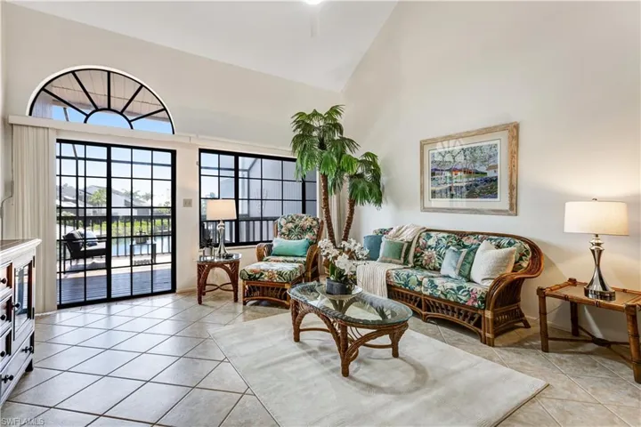 Bright and airy living space with vaulted ceilings and large windows