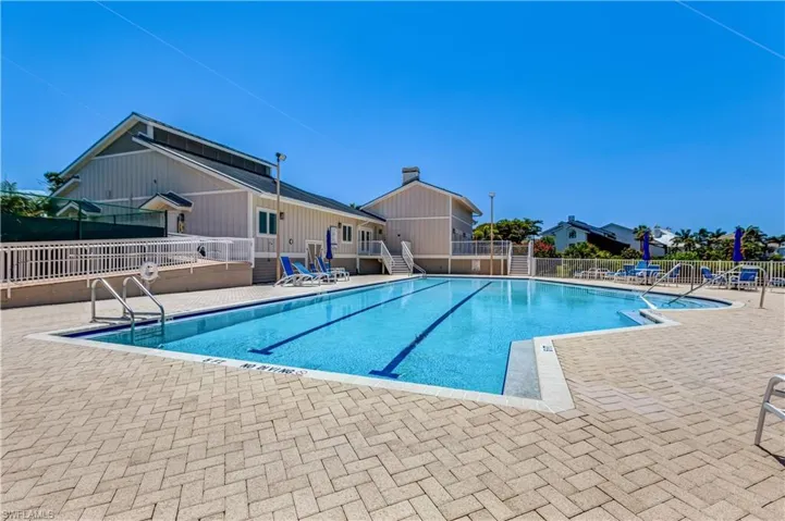 Enjoy the sparkling community pool and lounging area