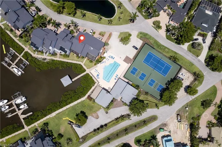 Aerial view of the community pool and tennis courts.