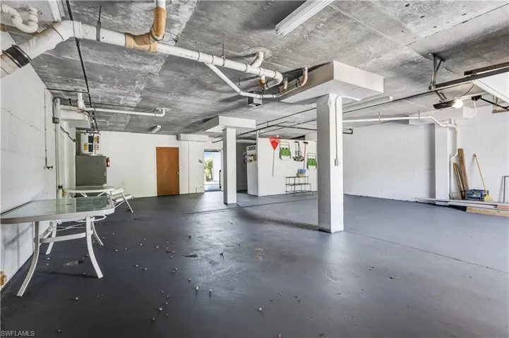 Spacious ground-level garage with ample storage and workspace