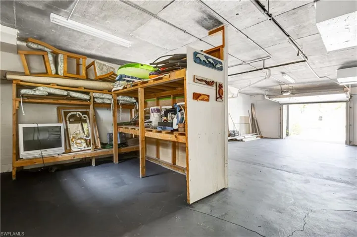 Spacious ground-level garage with ample storage and workspace