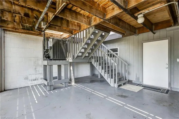 Spacious ground-level garage with ample storage and workspace