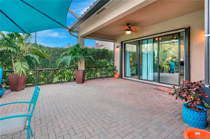 View of patio featuring ceiling fan