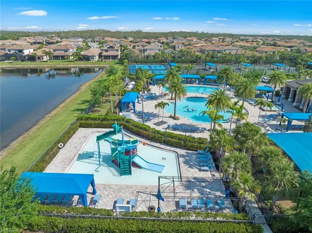 Birds eye view of property featuring a water view